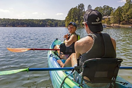 a person rowing a boat in a body of water